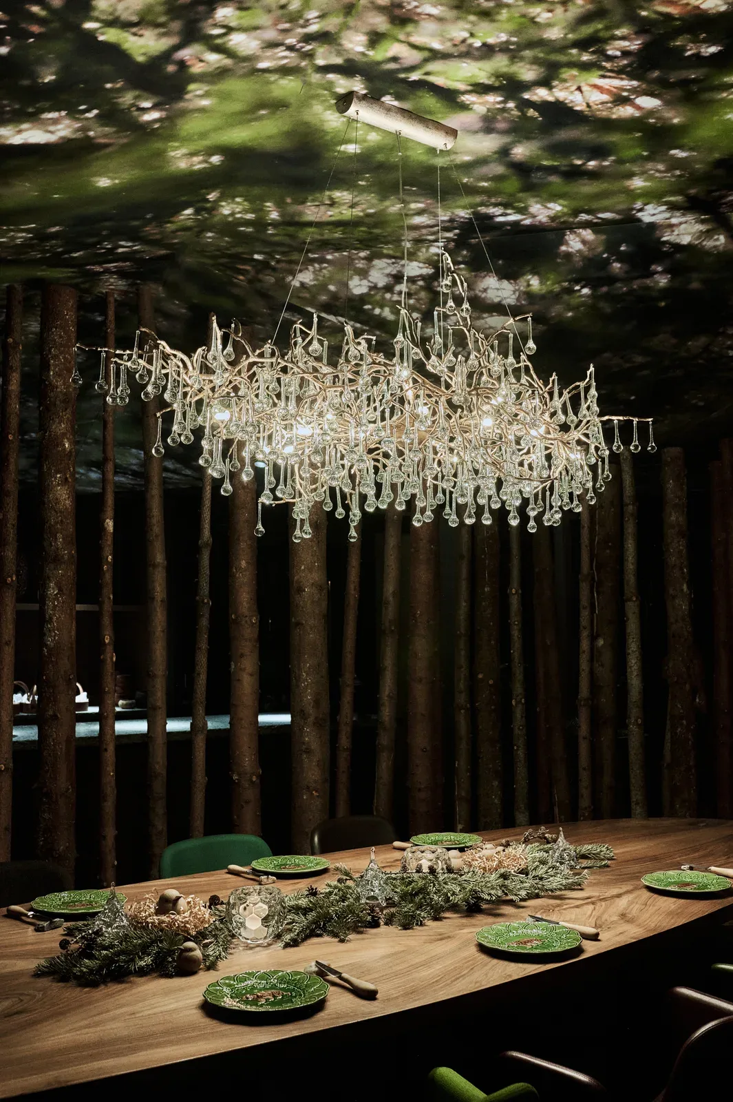 The dining room beneath its crystal chandelier